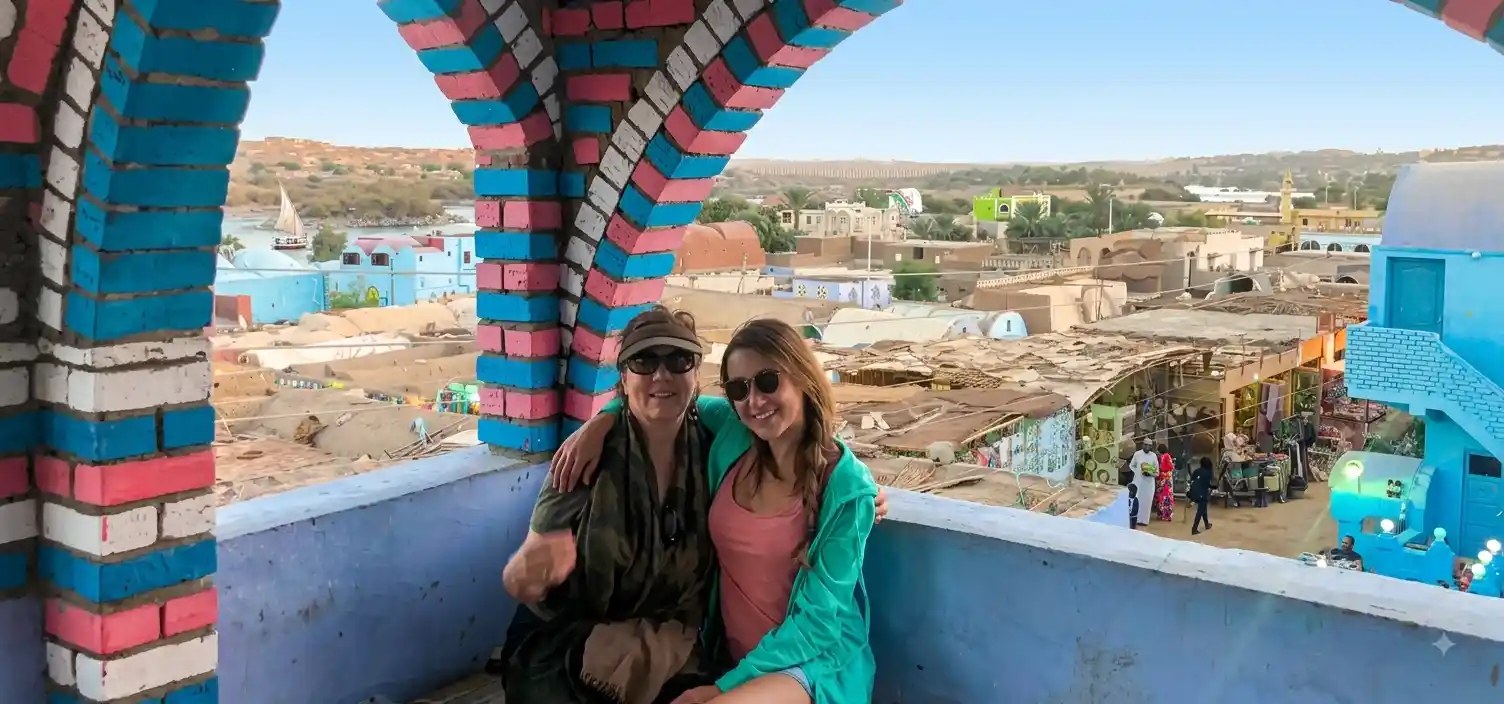 Visitors on a colourful terrace in a Nubian village near Aswan