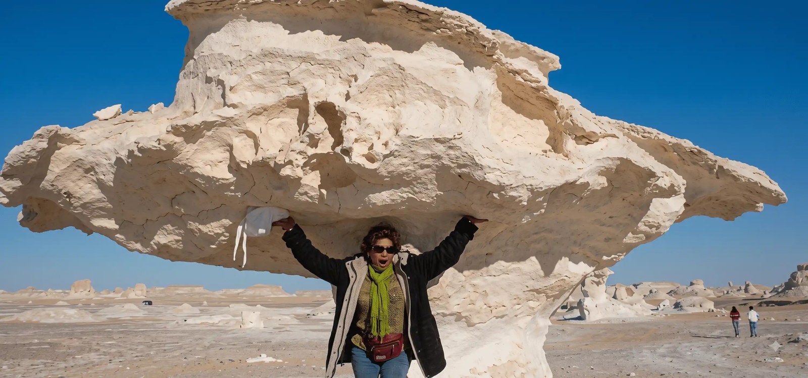 White Desert rock formation with a visitor in the foreground